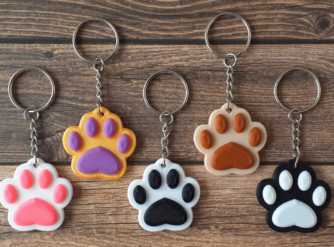 "3D-gedruckter Pfötchen Schlüsselanhänger für Tierliebhaber in verschiedenen Farben"